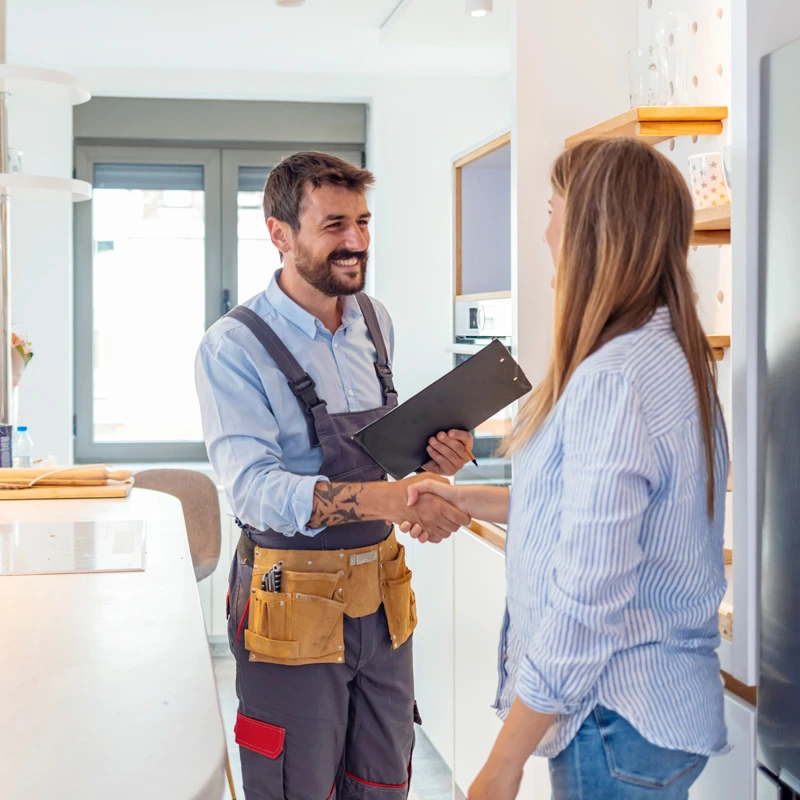 plumber shaking hands with customer