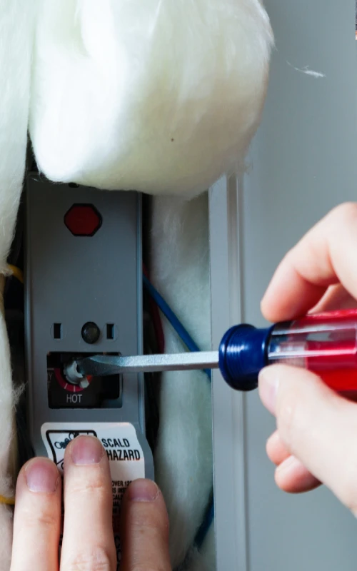 plumber fixing a water heater