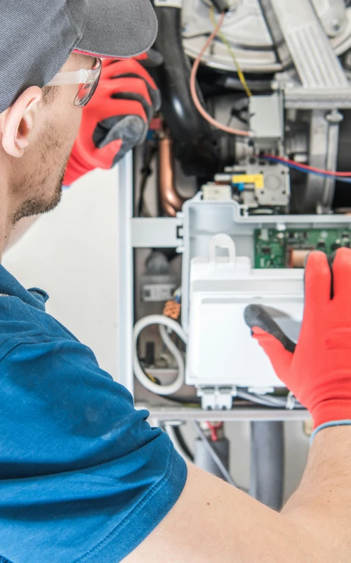 plumber installing a tankless water heater