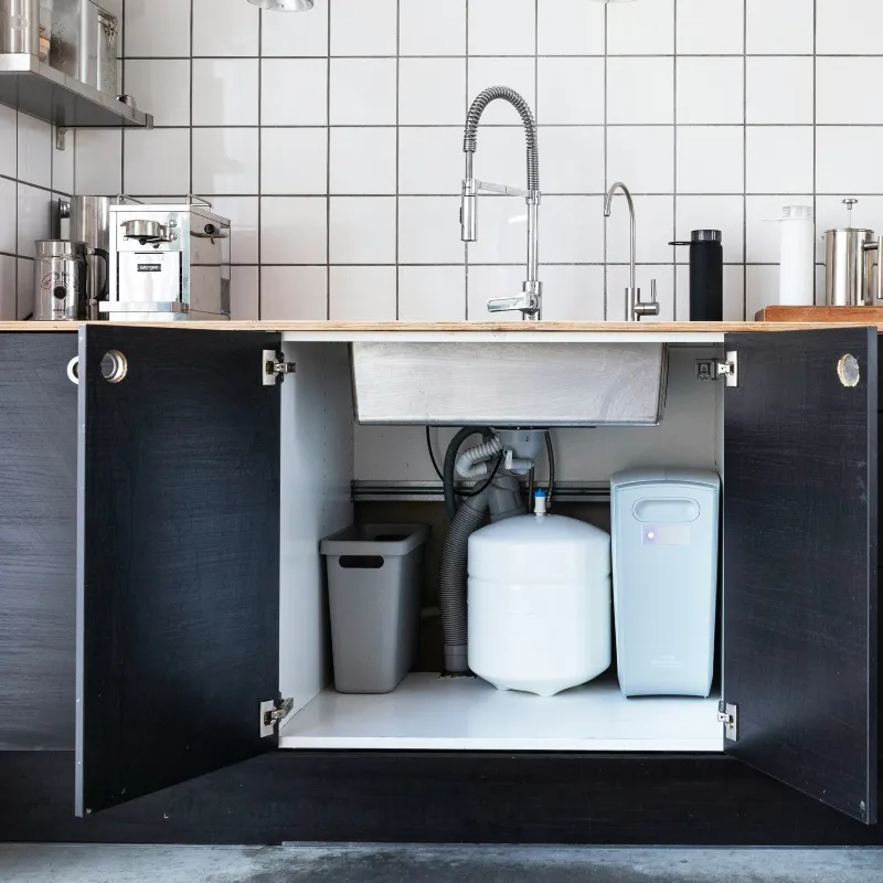 water softener equipment connected to the sink